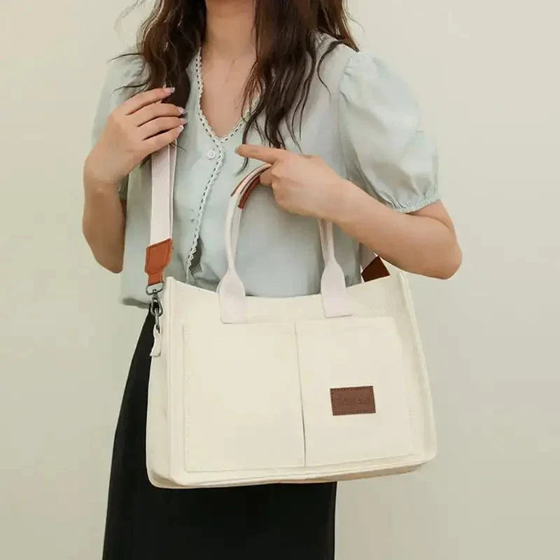 Premium canvas tote bag with multiple pockets, adjustable shoulder strap, and stylish design for everyday use