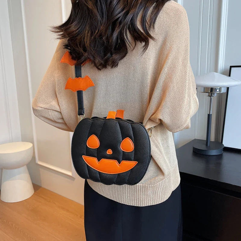 Pumpkin cartoon shoulder bag with adjustable strap and roomy interior, available in various Halloween-inspired colors