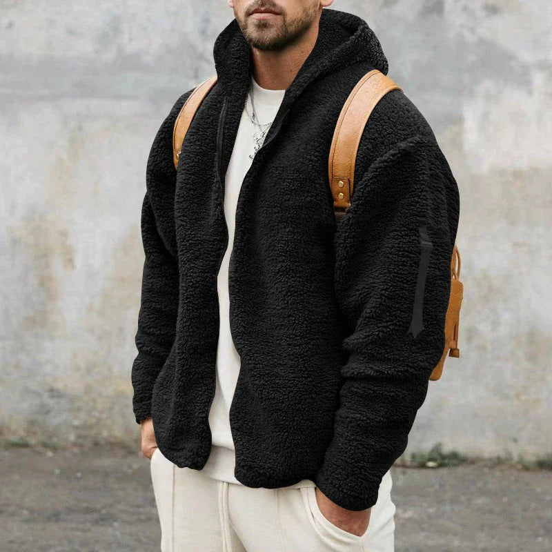 Plush hooded jacket in various colours, featuring a cosy design with a relaxed fit and convenient side pockets