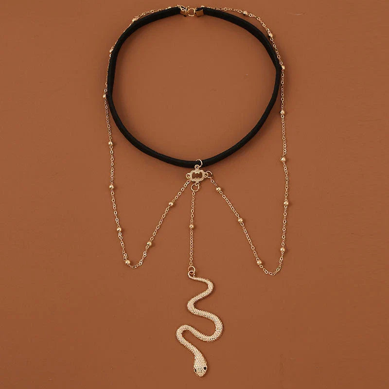 Fashionable gold beaded leg chain with snake pendant for women, featuring a captivating design and adjustable fit for comfortable wear.