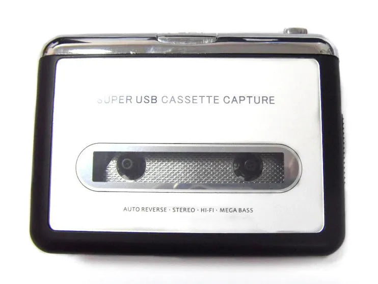 Cassette to MP3 converter unit with USB cable on a desk next to a cassette tape