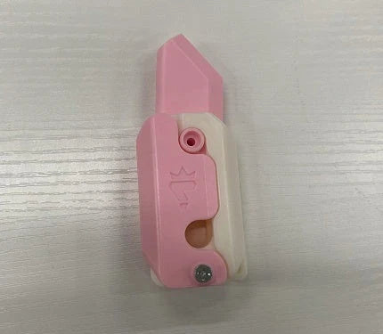 3D printed carrot-shaped fidget knife with gravity-powered hidden blade for stress relief and entertainment