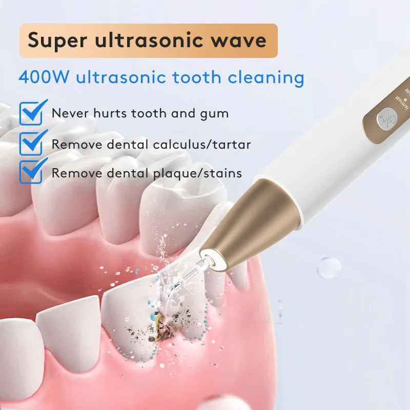 Gold-coloured ultrasonic tooth cleaner and tartar remover device with a stainless steel tip.