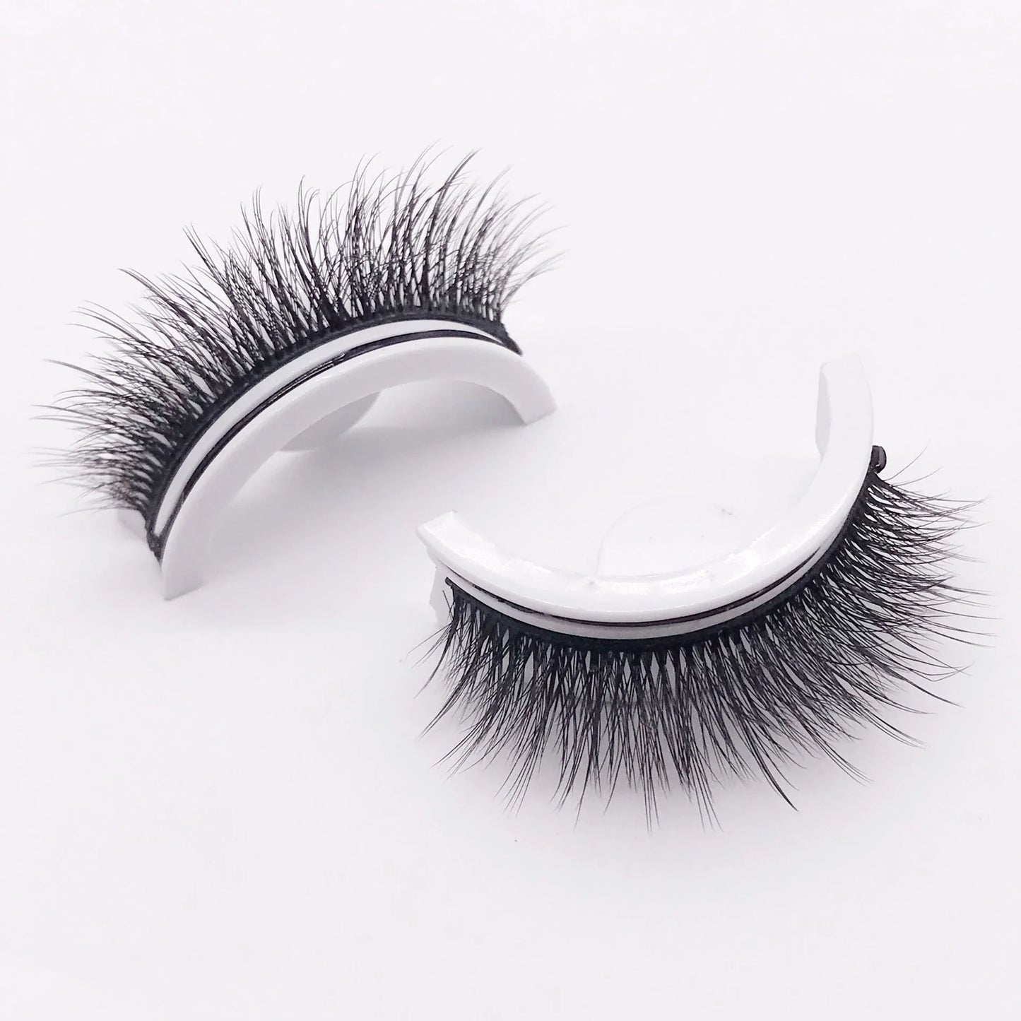 Glamorous 3D mink-inspired false eyelashes in various styles and packaging
