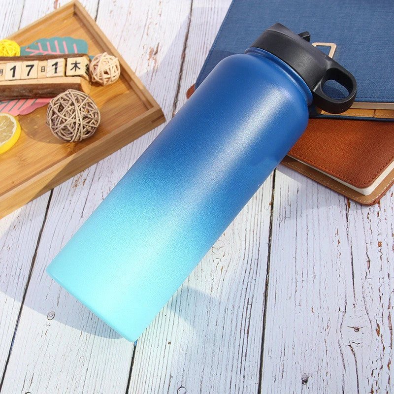 Stainless steel insulated water bottle with wide mouth and push-button lid for hot and cold beverages
