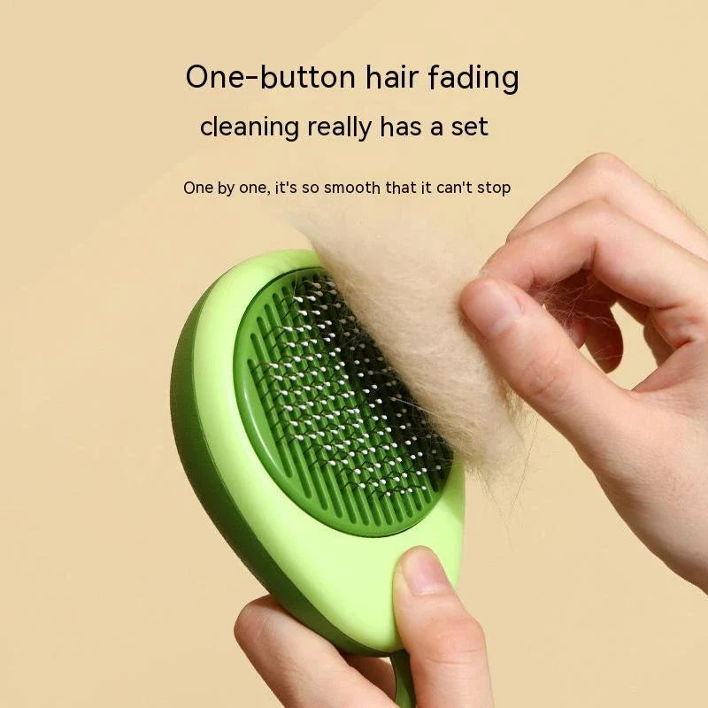 Plush avocado-shaped pet grooming brush with massage function for cats and dogs