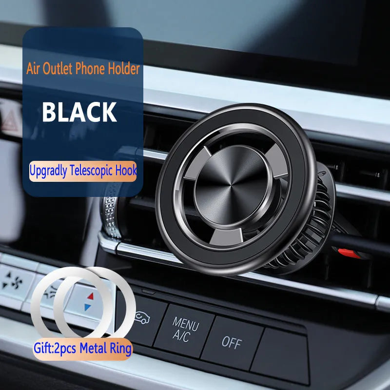 Silver magnetic car phone holder clipped to a car air vent, showing adjustable arm and ball joint.