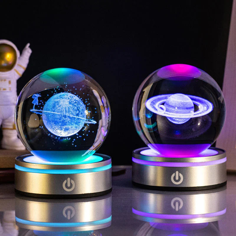 Luminous crystal ball with various celestial-inspired designs, including the Milky Way, Solar System, and Constellation.
