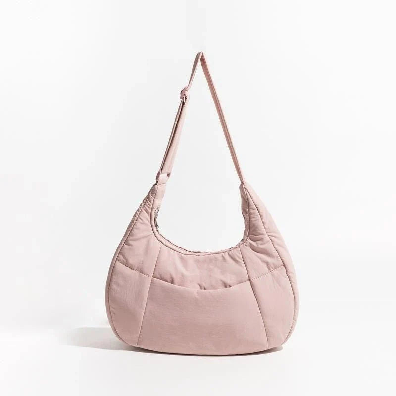 Chic Half Moon Puffer Shoulder Bag in Pink - Unique quilted design, secure zipper closure, and adjustable strap for everyday elegance