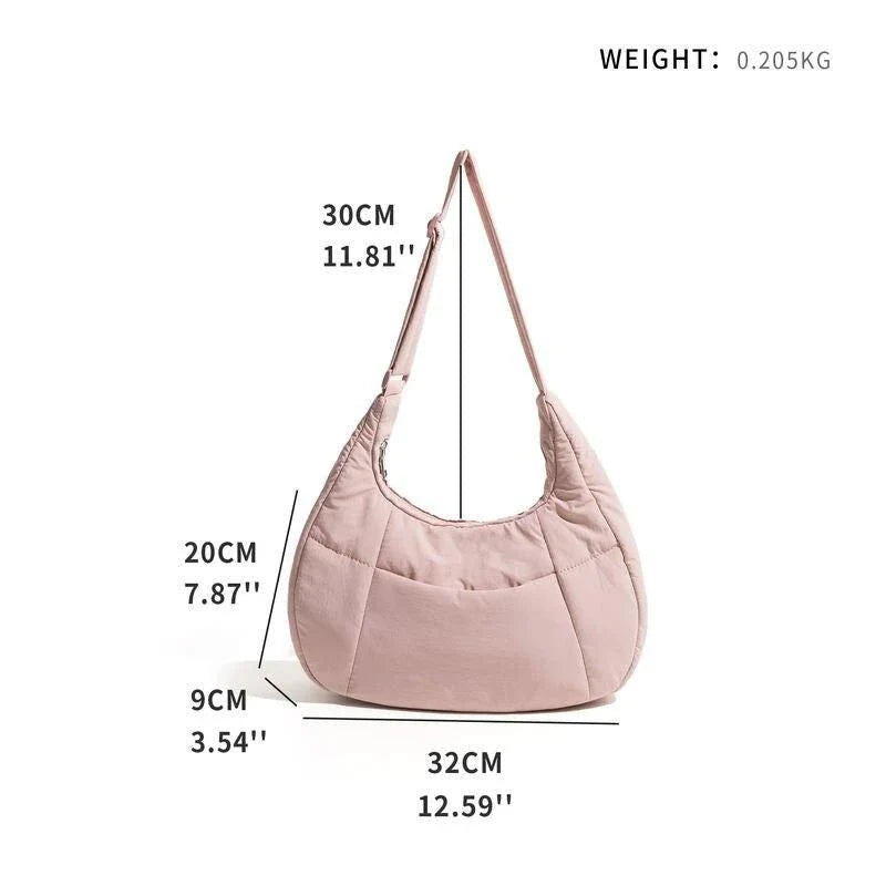 Chic Half Moon Puffer Shoulder Bag in Pink - Unique quilted design, secure zipper closure, and adjustable strap for everyday elegance