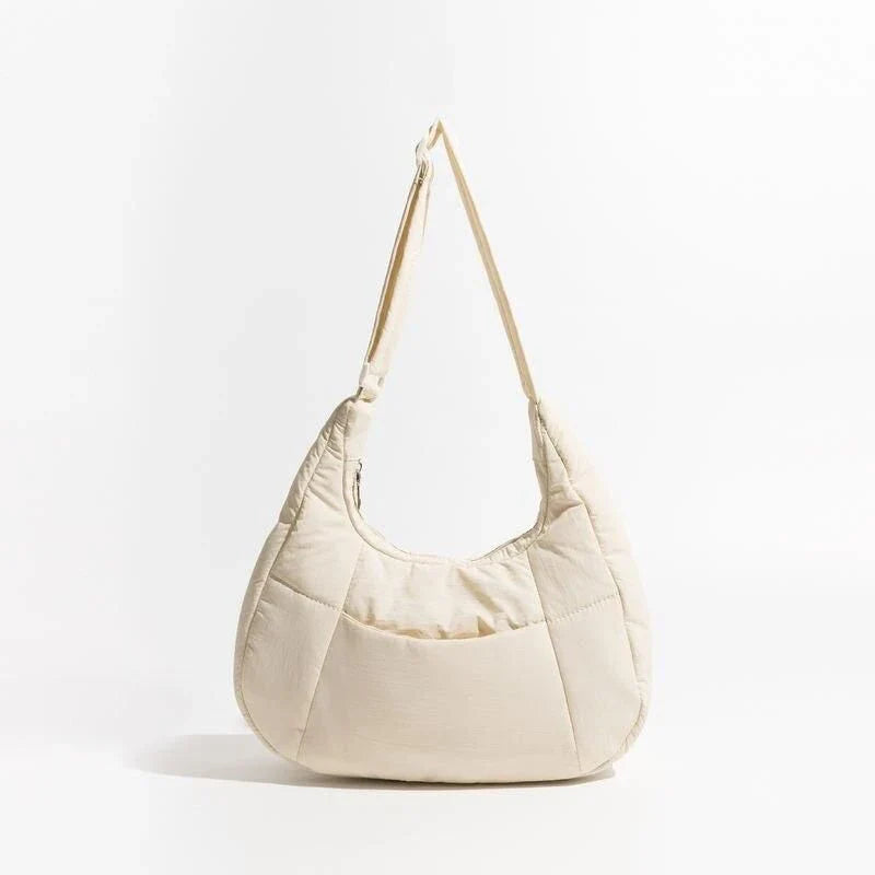 Chic Half Moon Puffer Shoulder Bag in Pink - Unique quilted design, secure zipper closure, and adjustable strap for everyday elegance