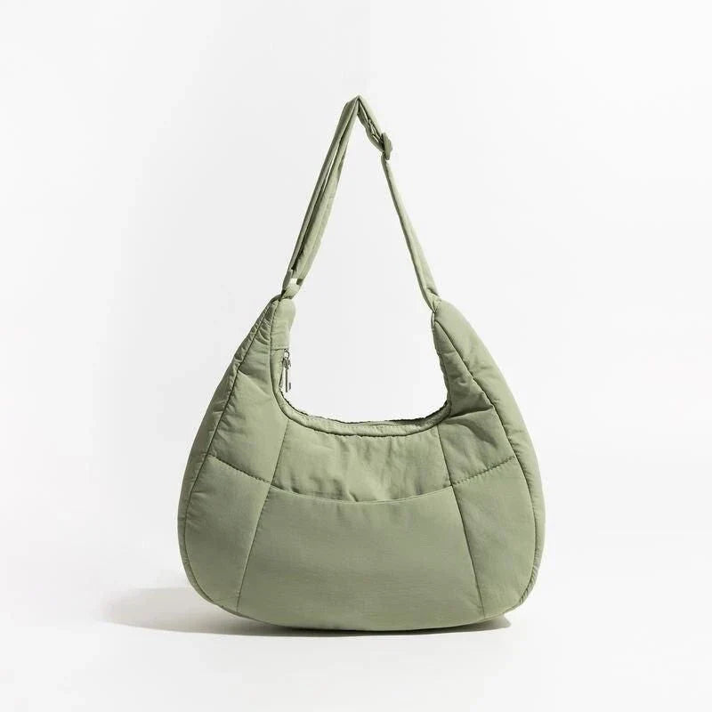 Chic Half Moon Puffer Shoulder Bag in Pink - Unique quilted design, secure zipper closure, and adjustable strap for everyday elegance