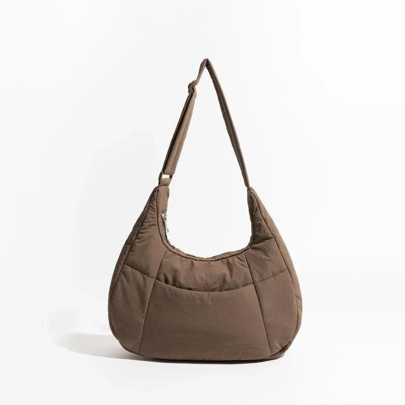 Chic Half Moon Puffer Shoulder Bag in Pink - Unique quilted design, secure zipper closure, and adjustable strap for everyday elegance