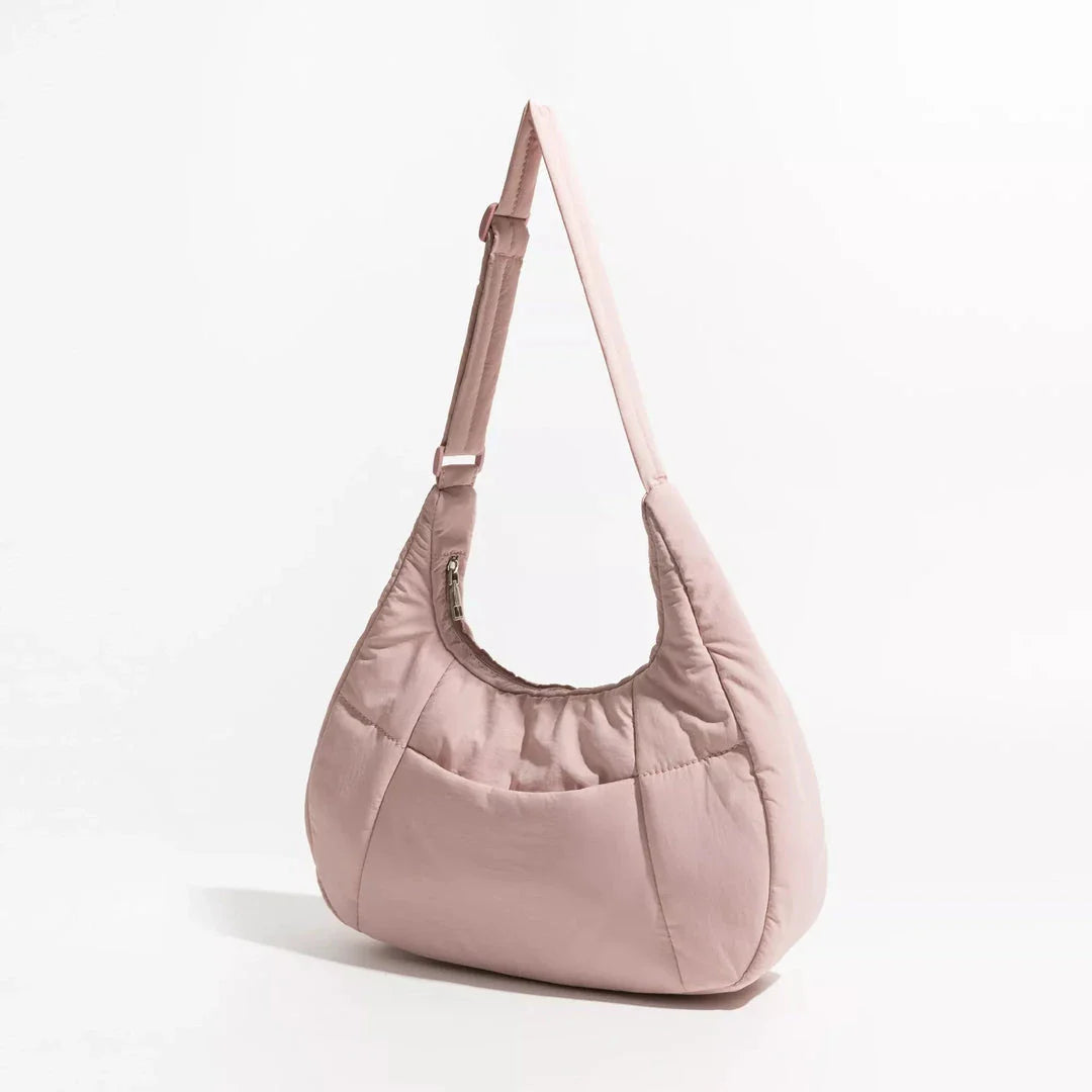 Chic Half Moon Puffer Shoulder Bag in Pink - Unique quilted design, secure zipper closure, and adjustable strap for everyday elegance
