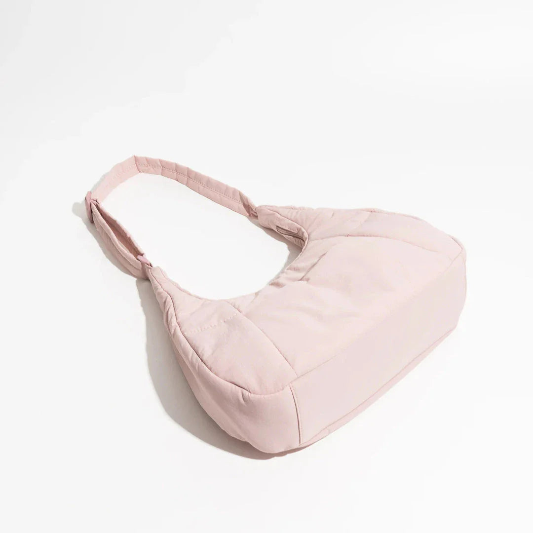 Chic Half Moon Puffer Shoulder Bag in Pink - Unique quilted design, secure zipper closure, and adjustable strap for everyday elegance