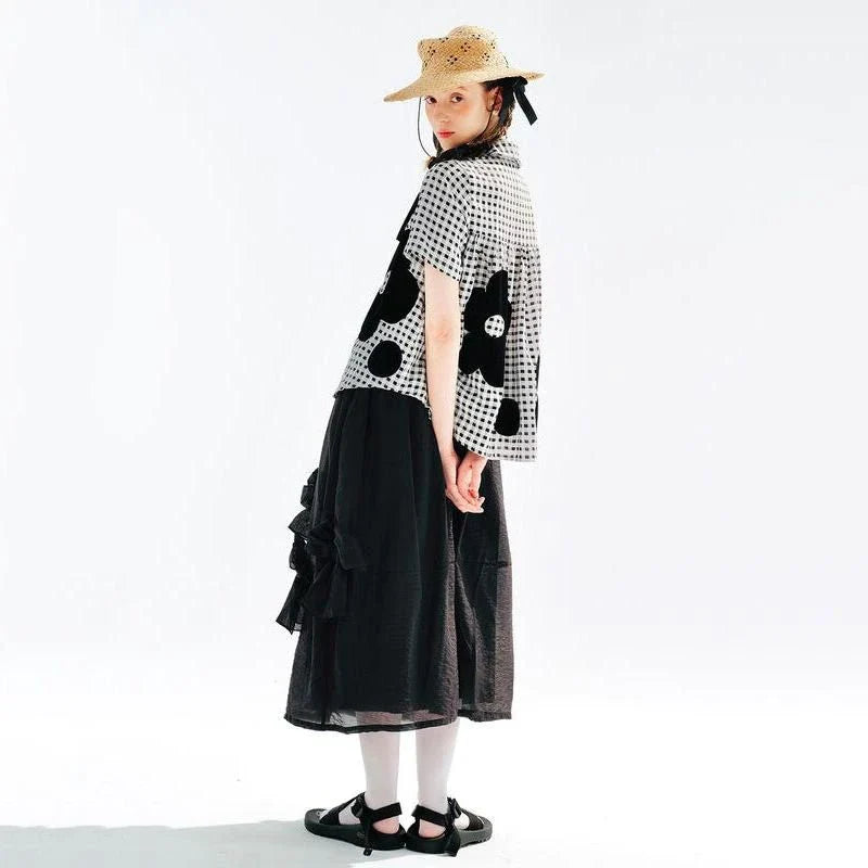 Chic Black Bow A-Line Midi Skirt for women, featuring a flattering A-line silhouette and elegant mid-calf length.