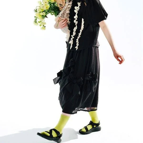 Chic Black Bow A-Line Midi Skirt for women, featuring a flattering A-line silhouette and elegant mid-calf length.