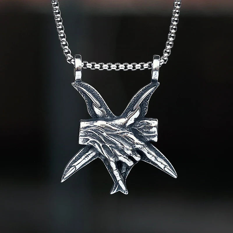 A close-up view of a three-dimensional pendant necklace made of titanium steel, showcasing its sleek and sophisticated design.