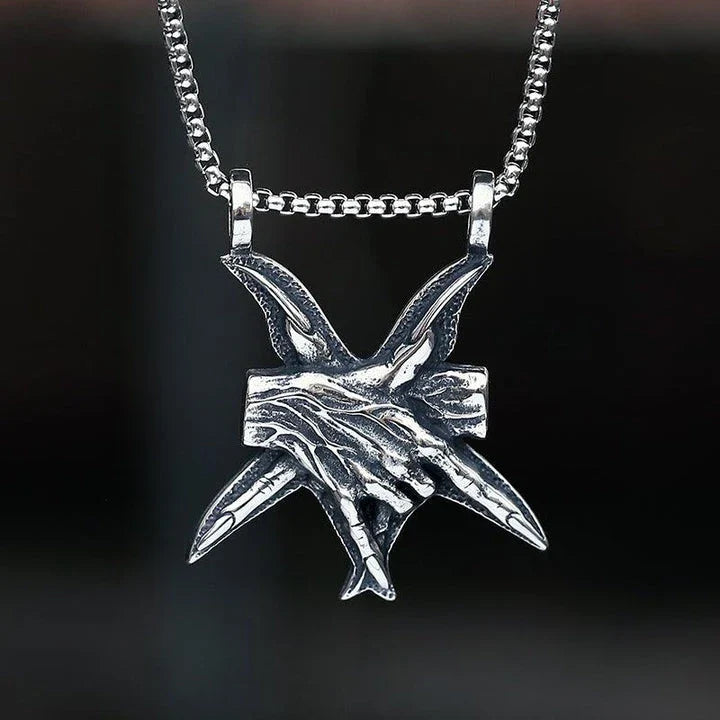 A close-up view of a three-dimensional pendant necklace made of titanium steel, showcasing its sleek and sophisticated design.