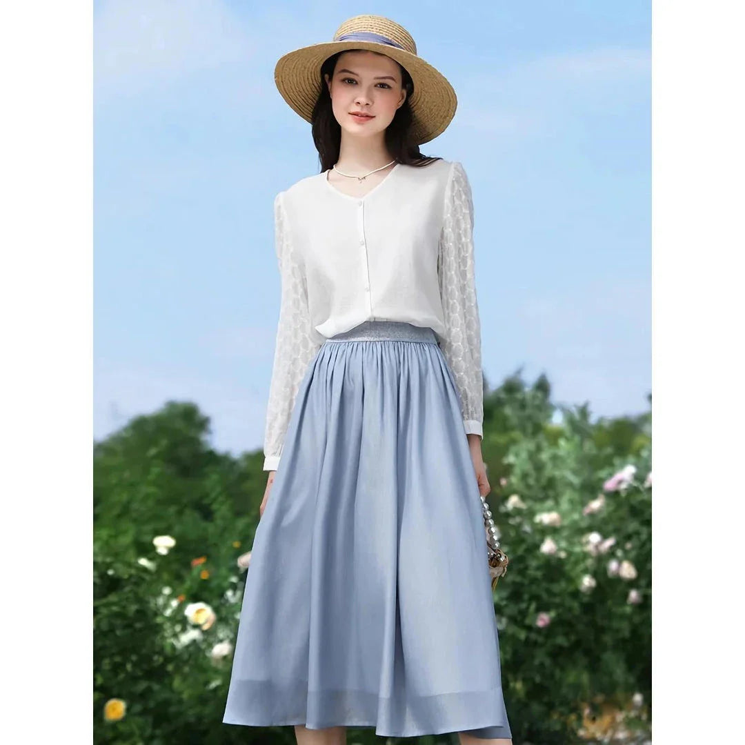 A French-inspired chic v-neck women's blouse in a crisp white colour, featuring a stylish spliced design and a flattering, tailored silhouette.