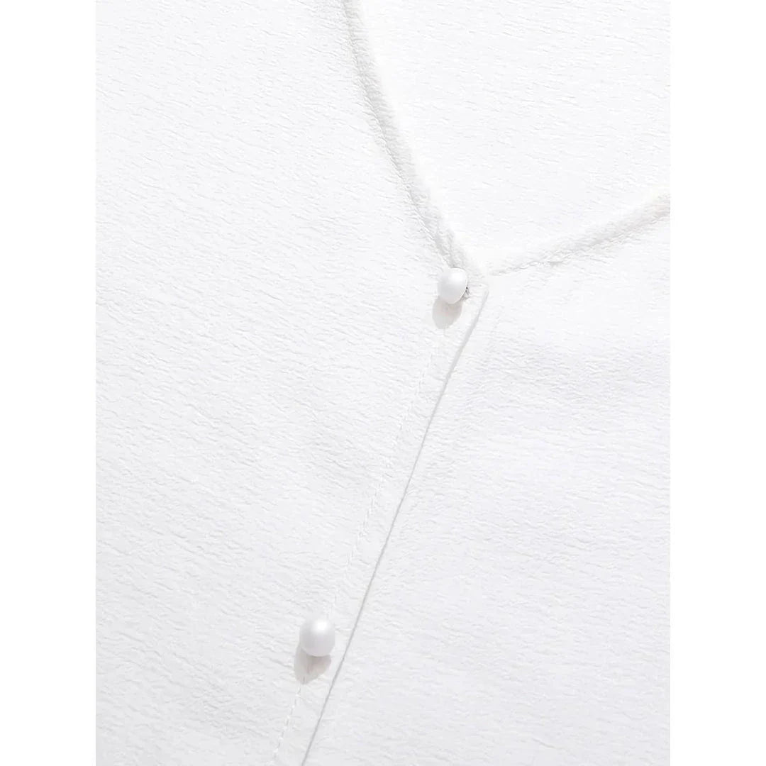 A French-inspired chic v-neck women's blouse in a crisp white colour, featuring a stylish spliced design and a flattering, tailored silhouette.