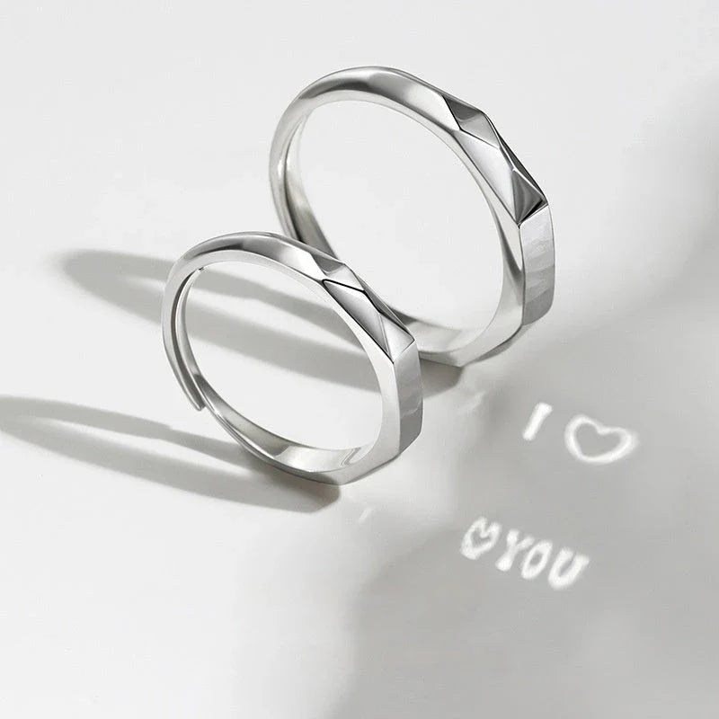 Elegant S925 sterling silver rings with a hidden love pattern design, adjustable sizing for a personalized fit.
