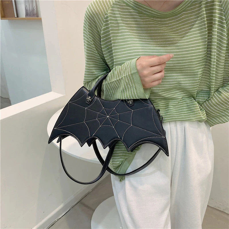 A stylish Halloween shoulder bag with a captivating spider web design, made of durable PU leather and offering ample storage space.