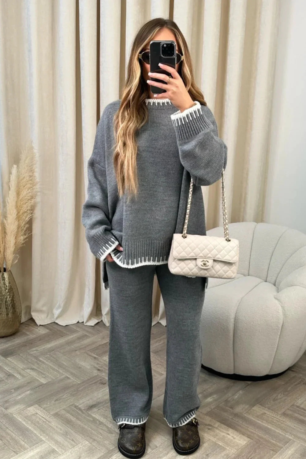 Stylish women's two-piece suit set with long-sleeved top and loose pants in various colours