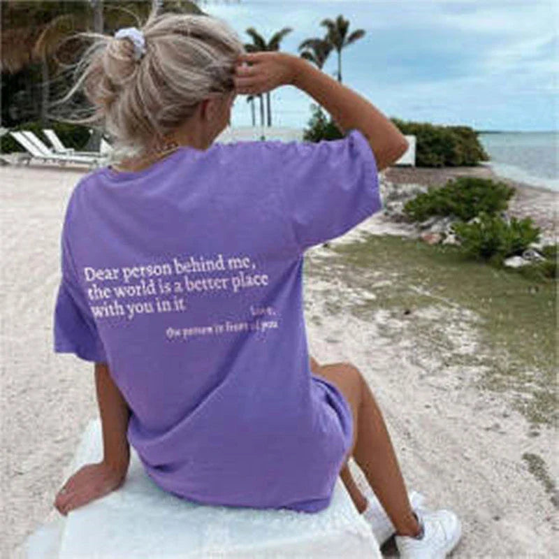 Stylish women's graphic t-shirt with trendy slogan, featuring a vibrant print design and comfortable short sleeve silhouette.