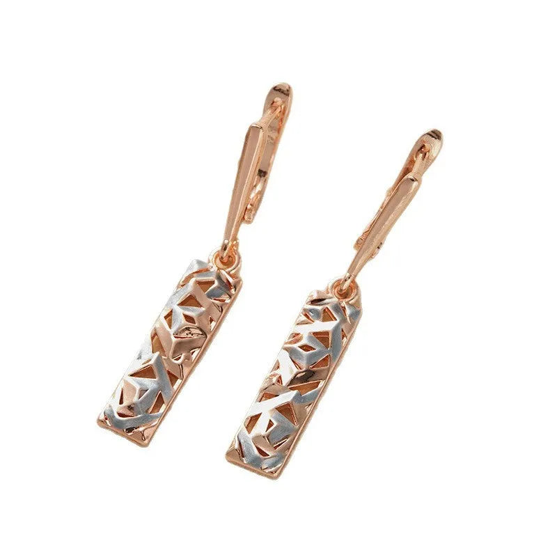 A pair of rectangular hollow stud earrings with a two-tone electroplated finish.