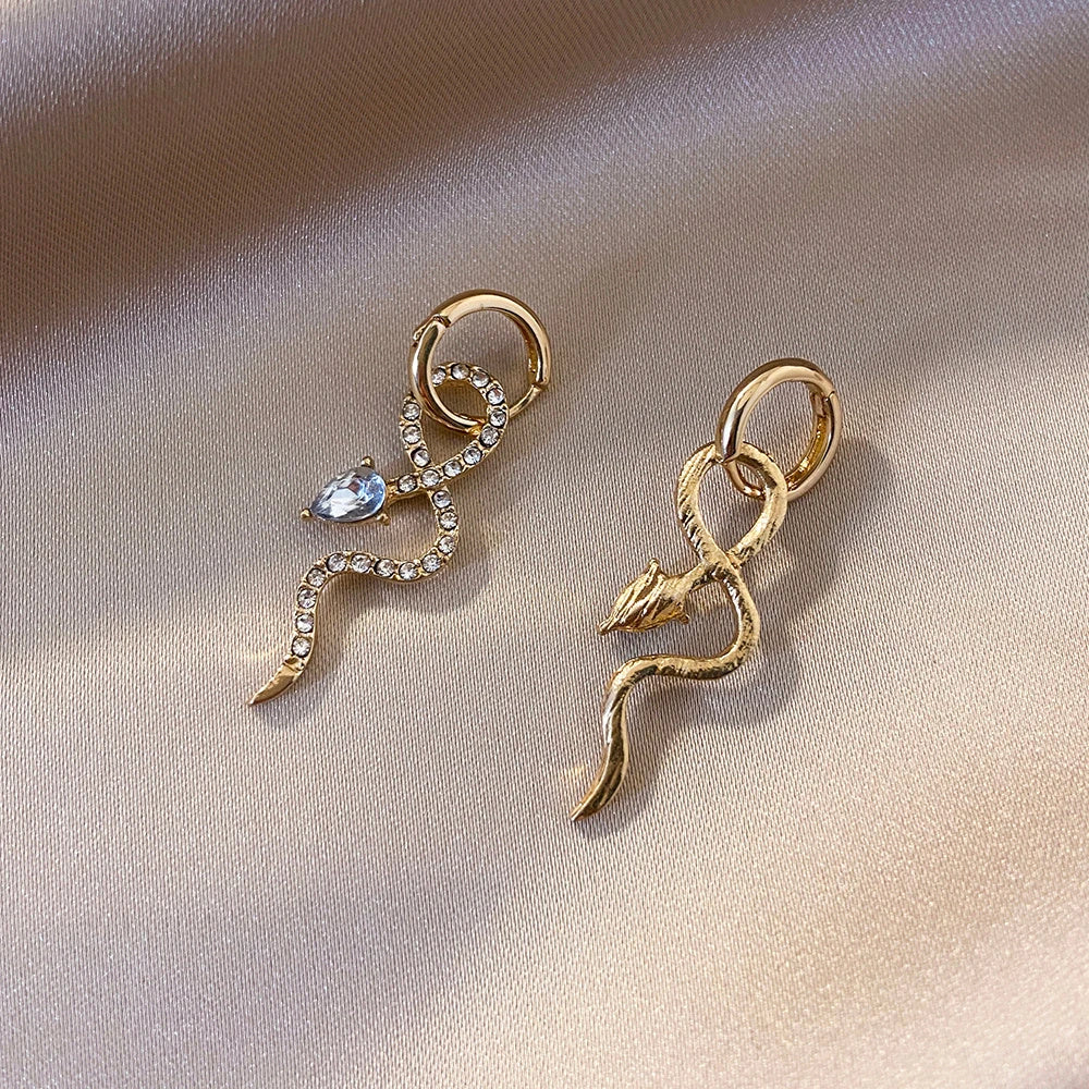 Elegant gold snake dangle earrings with a captivating serpentine design