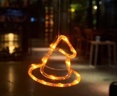 Spooky Halloween window lights featuring ghostly silhouettes, carved pumpkins, and creepy spiders for festive seasonal decor