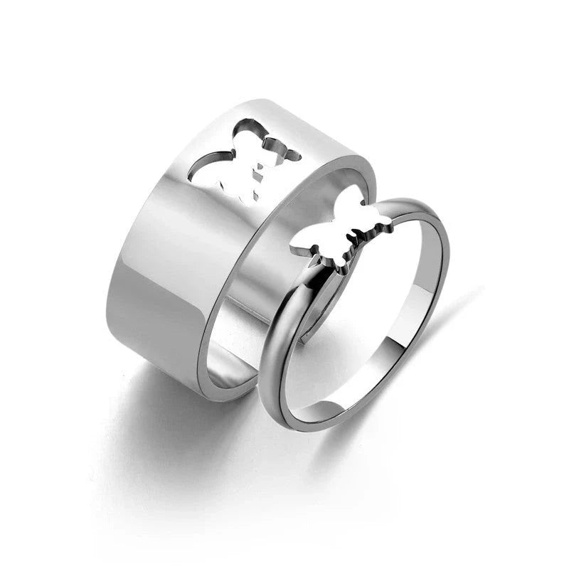 Elegant titanium steel rings in various designs including hearts, butterflies, and crosses, for a timeless and versatile accessory