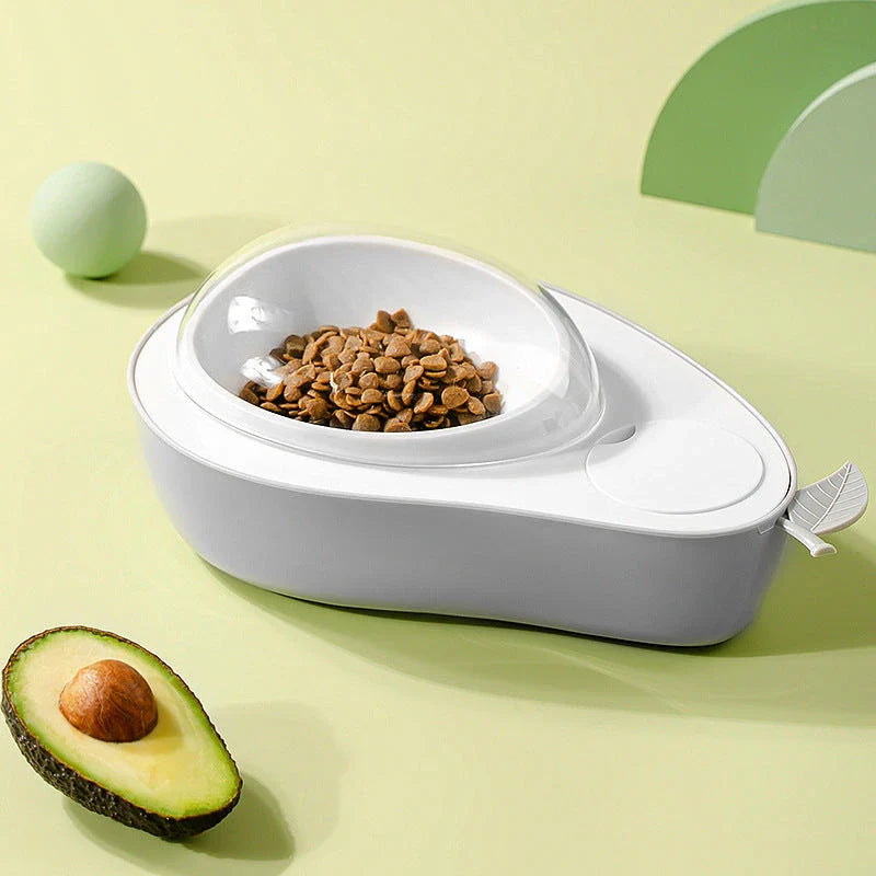 Avocado-shaped automatic pet food and water dispenser for dogs and cats, featuring a raised feeder, slow-feed bowl, and adjustable water flow