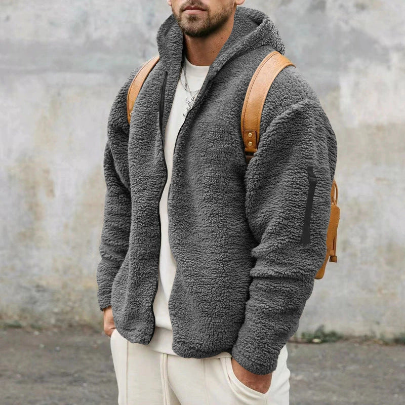 Plush hooded jacket in various colours, featuring a cosy design with a relaxed fit and convenient side pockets