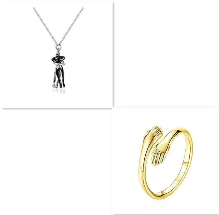 Stylish embracing pendant necklace in various colors, including rose gold, white black, black gold, and more. Minimalist design with a delicate chain.