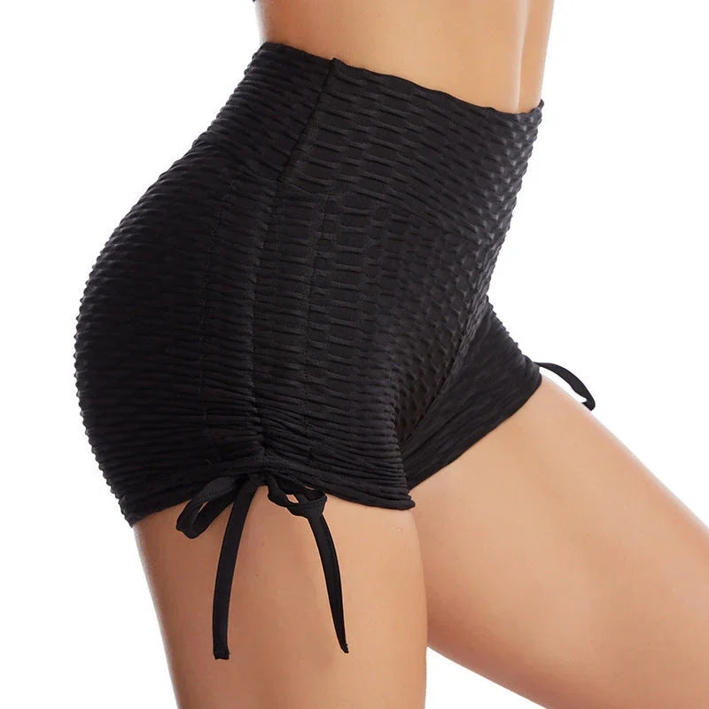Curve-enhancing workout shorts in a variety of vibrant colors with a drawstring waistband for a customized fit.