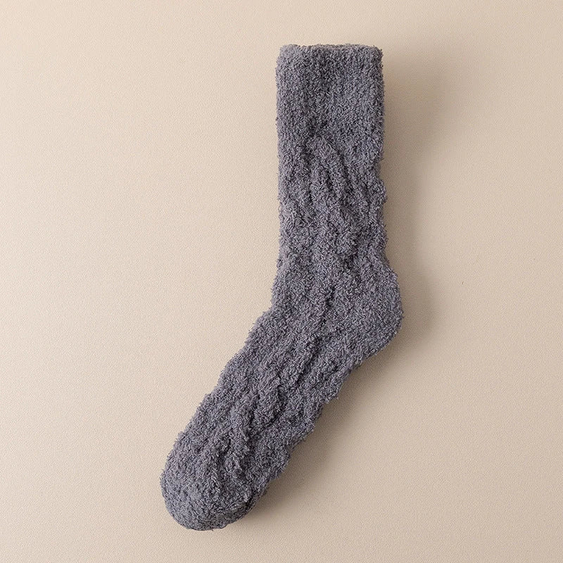 Plush coral fleece socks in various colors, designed for cozy and comfortable home wear