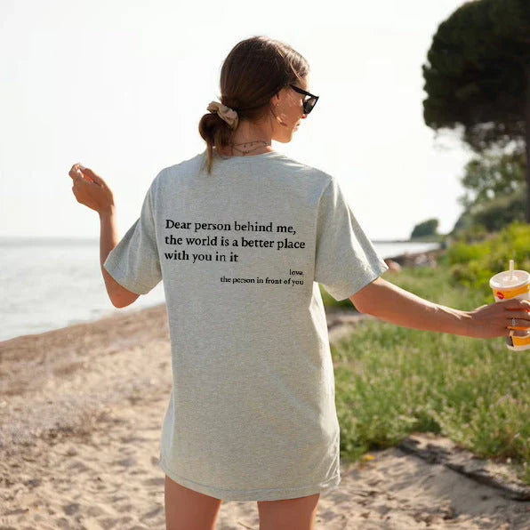 Stylish women's graphic t-shirt with trendy slogan, featuring a vibrant print design and comfortable short sleeve silhouette.