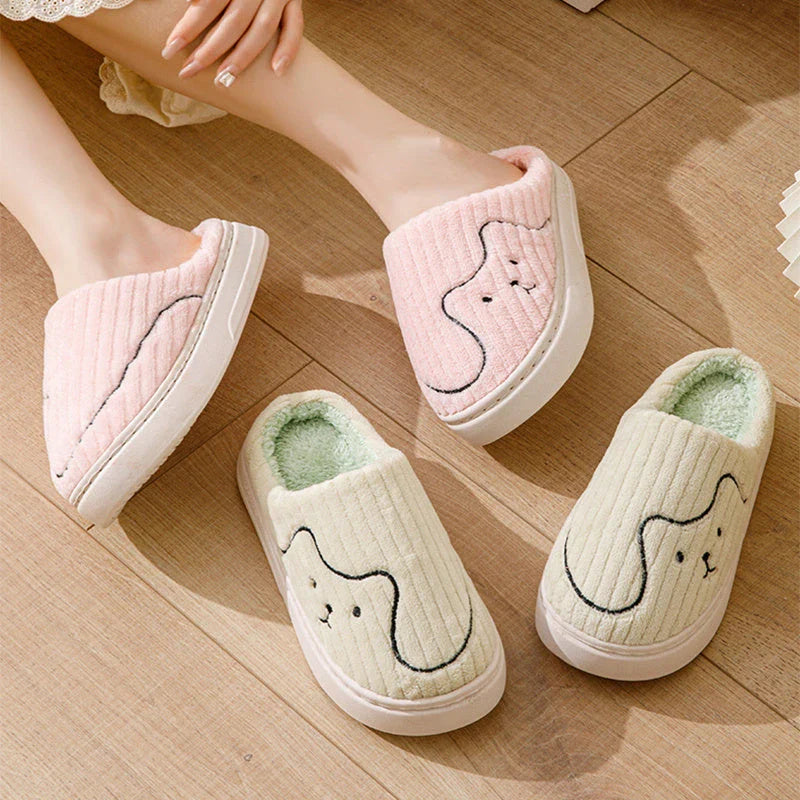 Cozy cat-themed house slippers in various colors with plush fabric and non-slip rubber soles