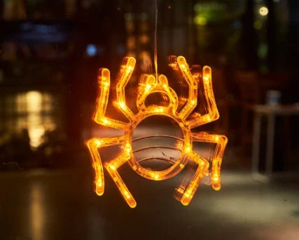 Spooky Halloween window lights featuring ghostly silhouettes, carved pumpkins, and creepy spiders for festive seasonal decor