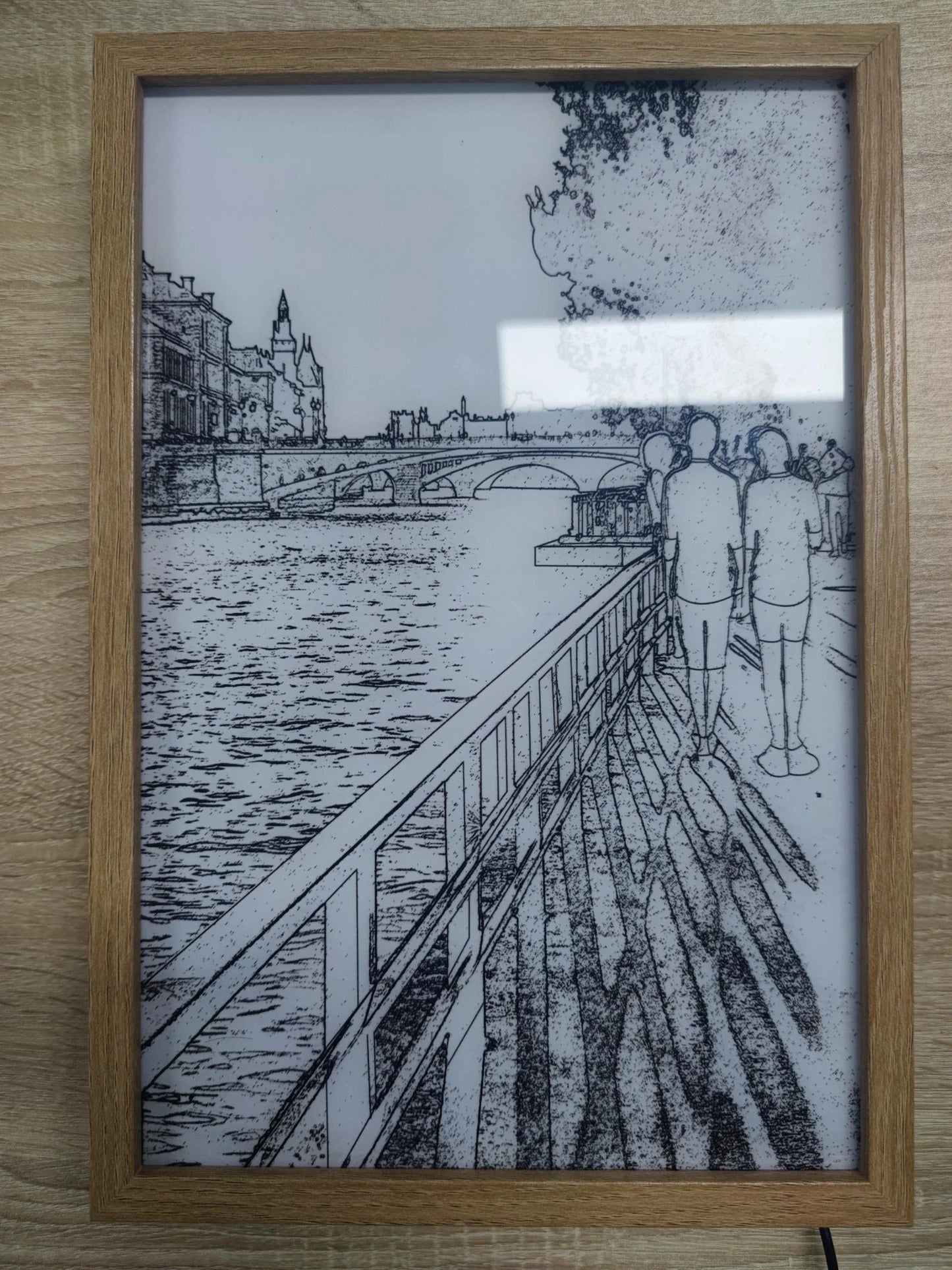 Illuminated picture frame with LED lights creating a mesmerizing display of art and ambiance