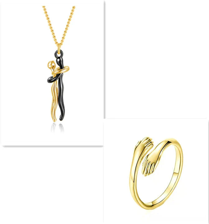 Stylish embracing pendant necklace in various colors, including rose gold, white black, black gold, and more. Minimalist design with a delicate chain.