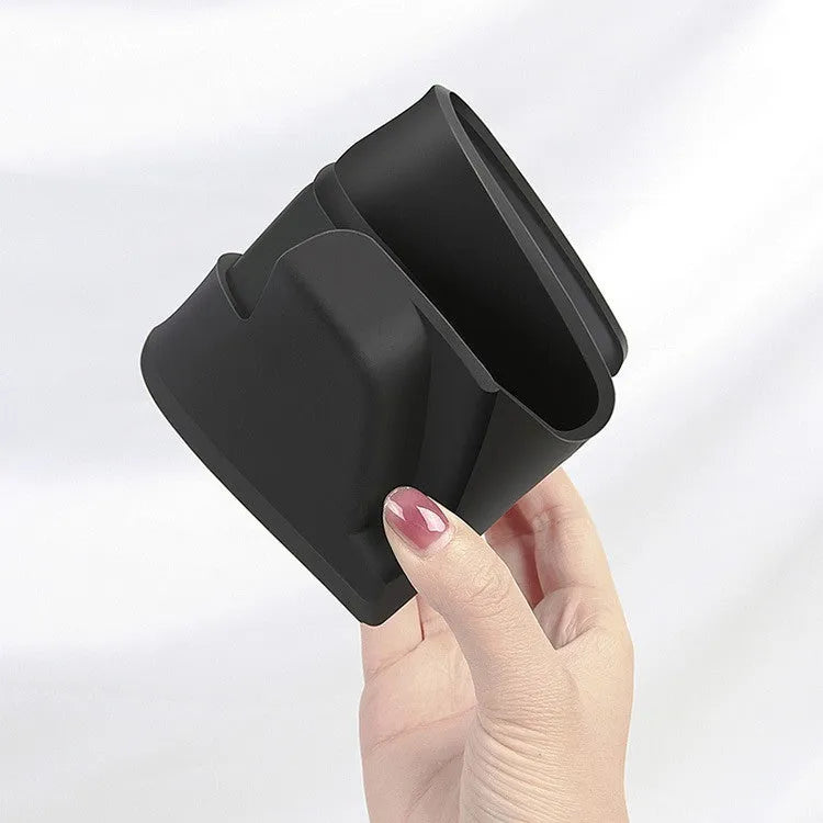 Black silicone glasses storage case installed in a Tesla Model 3 centre console armrest box.