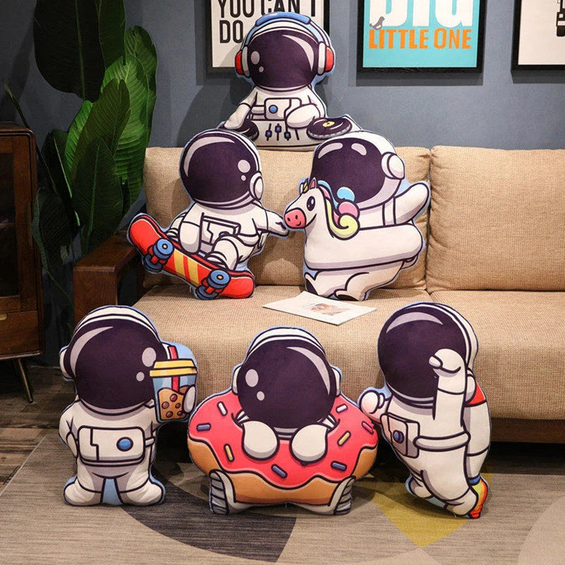 Soft plush astronaut pillows in various space-themed designs, including rockets, spacecraft, and more