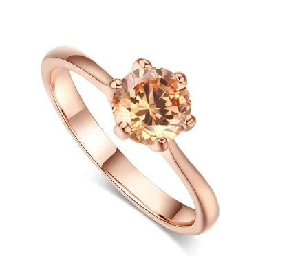 Close-up of a beautiful rose gold ring with sparkling zircon stones