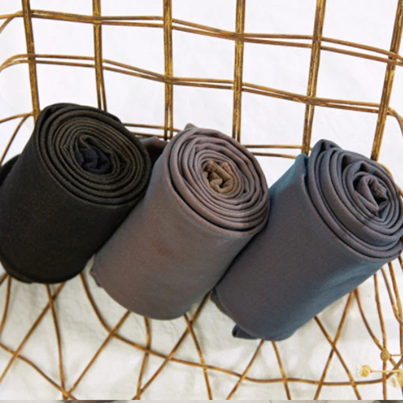 Cozy fleece-lined tights in various colors, featuring a unique translucent design and high-waisted fit for warmth and style.