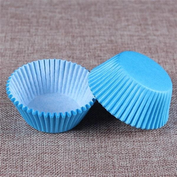 Colourful paper cupcake baking cups in a variety of vibrant shades, perfect for home baking and decorating