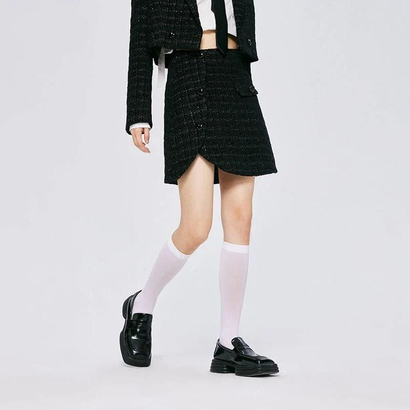 Chic asymmetric plaid a-line skirt in pink, featuring a unique design with button details and a flattering silhouette