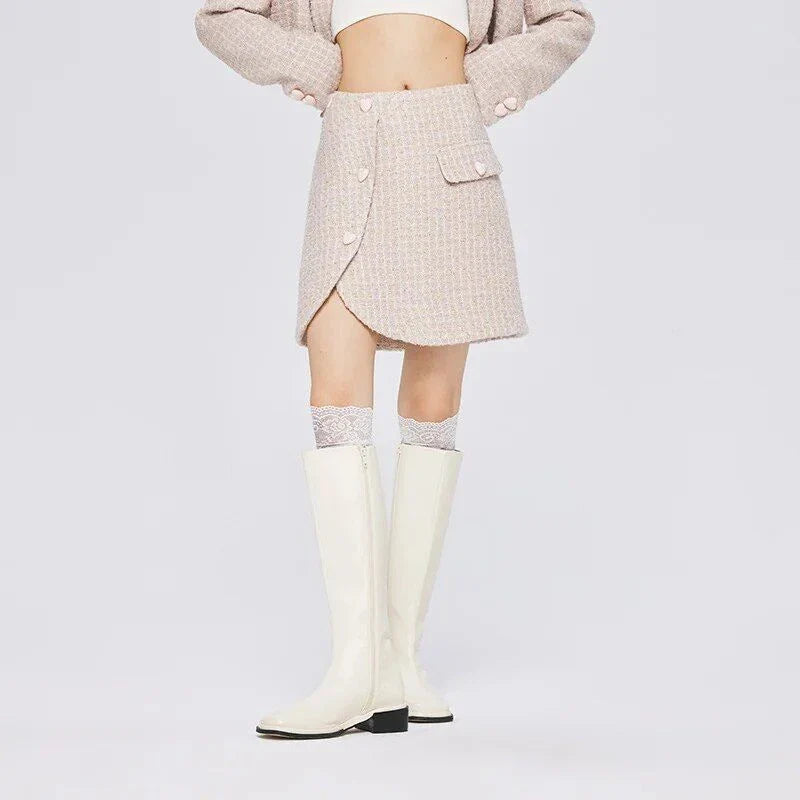 Chic asymmetric plaid a-line skirt in pink, featuring a unique design with button details and a flattering silhouette